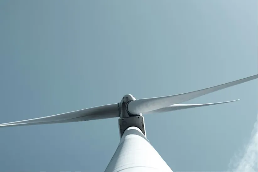 A wind farm at night under a clear sky